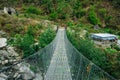 Hanging suspension bridge in himalaya Nepal Royalty Free Stock Photo