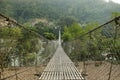 Hanging suspension bridge in Nepal Royalty Free Stock Photo