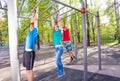 Hanging teenagers on the brachiating bar Royalty Free Stock Photo