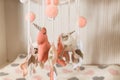 Hanging toys on the baby changing table