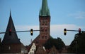 Hanging traffic lights in front of the skyline of luebeck Royalty Free Stock Photo