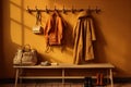 hanging wall rack and coats on bench Royalty Free Stock Photo