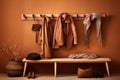 hanging wall rack and coats on bench Royalty Free Stock Photo