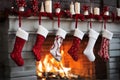 Hanging white red Christmas stockings by the Fireplace Royalty Free Stock Photo