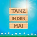 hanging wooden sign -tanz in den mai- maypole with colorful ribbons