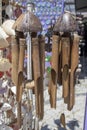 Hanging wooden wind bell. Close-up. Blurred background Royalty Free Stock Photo