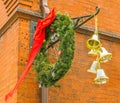 Hanging wreath and bells as Christmas decoration