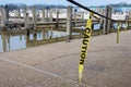 Hanging yellow caution tape strips Royalty Free Stock Photo
