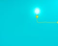 Hanging yellow light bulbs glowing on blue pastel background, Minimal concept idea