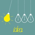 Hanging yellow light bulbs. Perpetual motion. Idea Royalty Free Stock Photo