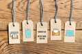 Hangtags on wooden background with message CONTACT US! WE ARE THERE FOR YOU