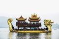 HANGZHOU, CHINA JANUARY 1 2018 : Golden Dragon boat with Tourists in West lake xihu in Hangzhou