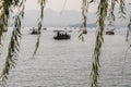 Hangzhou, China - November 9 2019: Beautiful day by the West Lake, a boat sailing on the lake Royalty Free Stock Photo