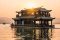 Hangzhou, China - November 9 2019: Beautiful sunset by the West Lake, a boat sailing on the lake Royalty Free Stock Photo