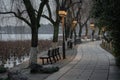 The footpath along the shore of the West Lake in Hangzhou after sunset on a rainy day Royalty Free Stock Photo