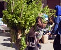 Hani woman carrying heavy load