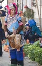 Hani Woman holding Chicken