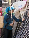 Hani Woman picking Sugar Cane