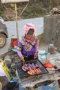 Hani woman preparing street food in the Shengcun local market in YuanYang. Hani are one of the 56 minorities in China and are nati