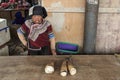 Hani woman selling bamboo in the Shengcun local market in YuanYang. Hani are one of the 56 minorities in China and are native of Y