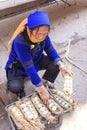 Hani woman selling eggs in the Shengcun local market in YuanYang. Hani are one of the 56 minorities in China and are native of Yua