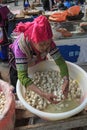 Hani woman selling tofu in the Shengcun local market in YuanYang. Hani are one of the 56 minorities in China and are native of Yua