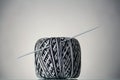 Hank of black and white yarn and crochet hook, on grey Royalty Free Stock Photo