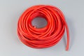 Hank of electrical single core cable in red insulating jacket Royalty Free Stock Photo