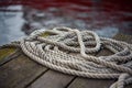 Old ship rope on a wooden pier