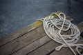 Old ship rope on a wooden pier