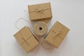 Hank of rope and three cardboard gift boxes