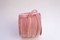 A hank of velvet pink coral for floristics and gift wrapping with a cute bow on the side