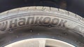 Hankook tire brand logo sign background