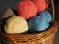 Hanks of woolen and acrylic threads. Knitting as a hobby. Accessories, balls of yarn and threads of white, pink and blue Royalty Free Stock Photo