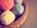 Hanks of woolen and acrylic threads. Knitting as a hobby. Accessories, balls of yarn and threads of white, pink and blue Royalty Free Stock Photo