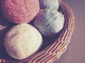 Hanks of woolen and acrylic threads. Knitting as a hobby. Accessories, balls of yarn and threads of white, pink and blue Royalty Free Stock Photo