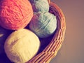 Hanks of woolen and acrylic threads. Knitting as a hobby. Accessories, balls of yarn and threads of white, pink and blue Royalty Free Stock Photo
