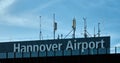Hannover Airport, large lettering above the main access at Terminal B of the North German airport, with many antennas