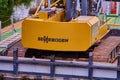 Close-up of a yellow excavator of the hydraulic engineering company Sennebogen