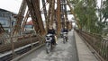 Hanoi, circa January 2020: Local motorbike driver on long bien bridge
