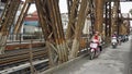 Hanoi, circa January 2020: Local motorbike driver on long bien bridge