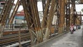 Hanoi, circa January 2020: Local motorbike driver on long bien bridge