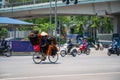 Hanoi street traffic with vendor cycling on Kim Ma street