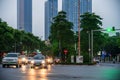 Hanoi traffic with modern buildings on Nguyen Chi Thanh street at twilight