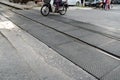 Hanoi train railroad crossing street with traffic on background