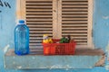 Hanoi, Vietnam - Apr 5, 2015: Group of beverage bottles in basket placed in front of window on background in Hanoi street