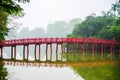 The Huc Bridge or Sun shine bridge at Hoan Kiem Lake, It`s a red wooden arch bridge