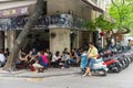 Hanoi, Vietnam - Apr 5, 2015: People have coffee, tea in a street cafe in Nguyen Huu Huan street, Hanoi