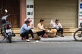 Hanoi, Vietnam - Apr 5, 2015: People have food on sidewalk in Luong Ngoc Quyen street Royalty Free Stock Photo