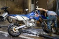 Hanoi, Vietnam - Apr 24, 2016: Racing dirt bike is washing at wash service on Nha Hoa street, Hanoi